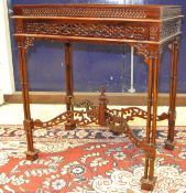 A modern mahogany occasional table with galleried top, pierced decoration in the Chippendale style,