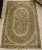 A Kashic rug, the central panel set with all-over floral sprays on a cream ground,