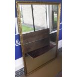 A large rectangular wall mirror in a moulded gilt effect frame CONDITION REPORTS