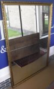 A large rectangular wall mirror in a moulded gilt effect frame CONDITION REPORTS