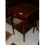 An Edwardian mahogany and inlaid oval drop-leaf table with single end drawer,