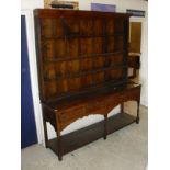 An 18th Century oak dresser with the three tier plate rack above a plain top,
