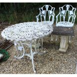A modern painted metal garden table and two chairs,
