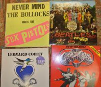 A large collection of assorted LP's to include two "Sergeant Pepper's Lonely Hearts Club Band" by