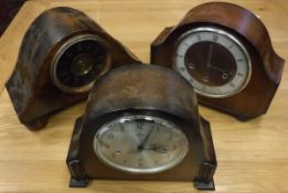 A collection of three mid 20th Century mantle clocks to include and oak mantle clock,