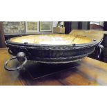 A large treenware and iron bound bowl with dished centre,