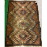 A Caucasian rug, the central panel set with repeating tarantula style motifs on a red ground,