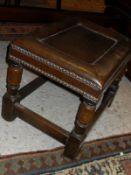 A leather topped footstool