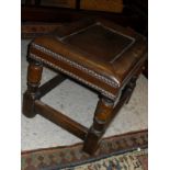 A leather topped footstool