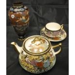 A collection of china wares to include a satsuma tea pot, two similarly decorated cups,