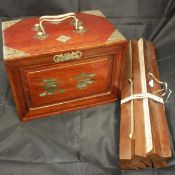 A Chinese bone and bamboo Mahjong set with table holders and score cards published by Continental