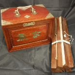 A Chinese bone and bamboo Mahjong set with table holders and score cards published by Continental