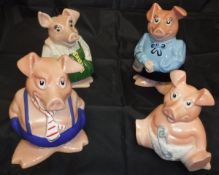 A set of four Nat West piggy banks,