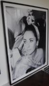 A black and white photographic print of Elizabeth Taylor