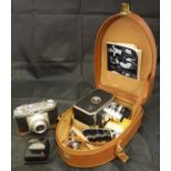 A box of various cameras and camera equipment to include a Bolex Paillard B8L 8mm cine camera