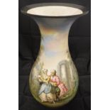 A French Pottery baluster shaped vase with painted decoration of a courting couple