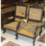 A pair of Victorian carved oak throne chairs in the gothic revival taste (for re-upholstery)