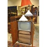 A Defiant CRT TV housed in a walnut case together with three various mahogany standard lamps