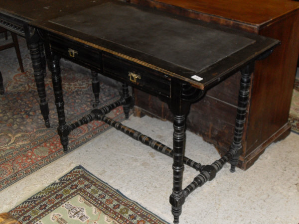 A late Victorian ebonised side table in the manner of E Godwin,