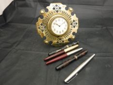 A brass clock with pierced decoration,