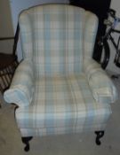 A Wesley-Barrell wing back arm chair in a duck egg blue,