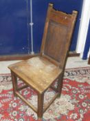 A set of five hard seated panel back dining chair raised on square section legs to stretchered