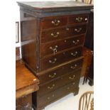 A 19th Century mahogany chest on chest with moulded pediment with Greek key moulding above two