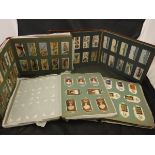 Ten various cigarette card albums containing various Wills, Players and Gallagher,
