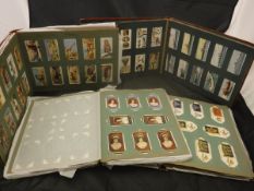 Ten various cigarette card albums containing various Wills, Players and Gallagher,