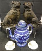 A pair of Staffordshire glazed pottery glass eyed pug ornaments,