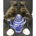 A pair of Staffordshire glazed pottery glass eyed pug ornaments,