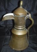 A late 18th / early 19th Century Middle Eastern brass and copper coffee pot with turned brass