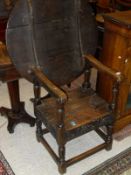 A 19th Century oak monks table with replacement top,