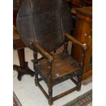 A 19th Century oak monks table with replacement top,