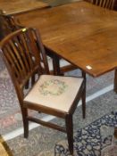 A 19th Century mahogany rectangular drop-leaf dining table on square tapered supports together with