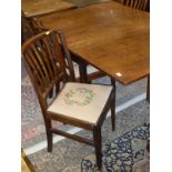 A 19th Century mahogany rectangular drop-leaf dining table on square tapered supports together with