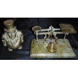 A cast brass money box of a pot-bellied gentleman in a top hat inscribed "Transvaal money box",