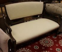 A 19th Century mahogany and inlaid two seat sofa in pale cream patterned upholstery on square