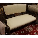 A 19th Century mahogany and inlaid two seat sofa in pale cream patterned upholstery on square