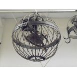 An armillary type sphere, together with a wrought iron hanging candle lamp and pot rack,