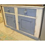 A white and blue painted sideboard with two drawers above two cupboard doors to plinth base,