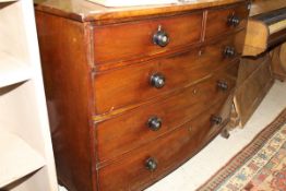 An early 19th Century mahogany bow fronted chest of two short over three long graduated drawers