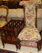 An early Victorian rosewood framed prie a dieu chair in a beige ground foliate upholstered back and
