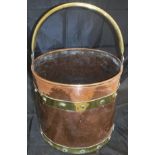 A 19th Century copper two-handled cooking vessel with lid,