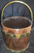 A 19th Century copper two-handled cooking vessel with lid,