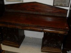 A 19th Century mahogany pedestal sideboard with architectural form back board with three drawers to