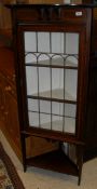 A mahogany and satinwood banded leaded and glazed corner display cabinet,