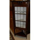 A mahogany and satinwood banded leaded and glazed corner display cabinet,