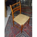 A set of six Swedish "Gemla" chairs with ladder backs over leather seats on turned legs united by