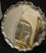 An Edwardian silver presentation salver in the Georgian manner with pie crust rim,